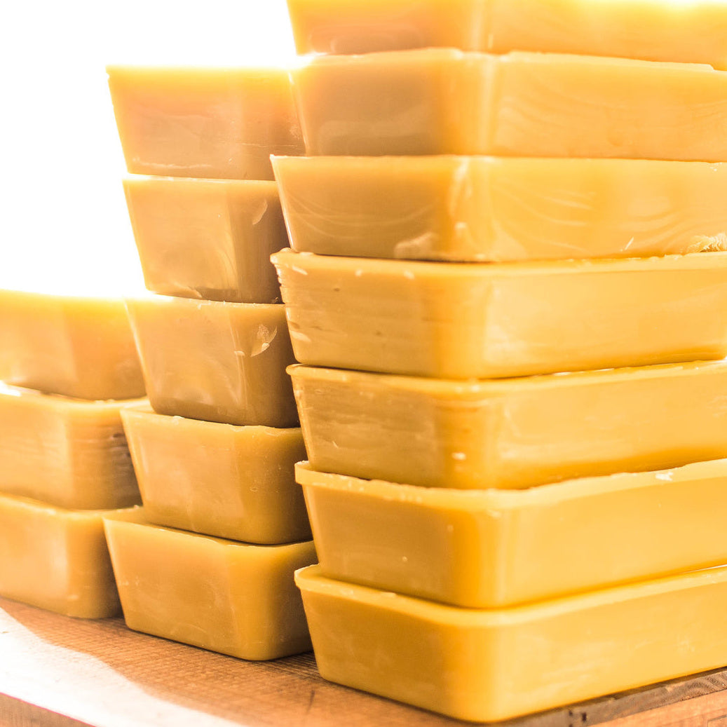 stacks of british beeswax blocks
